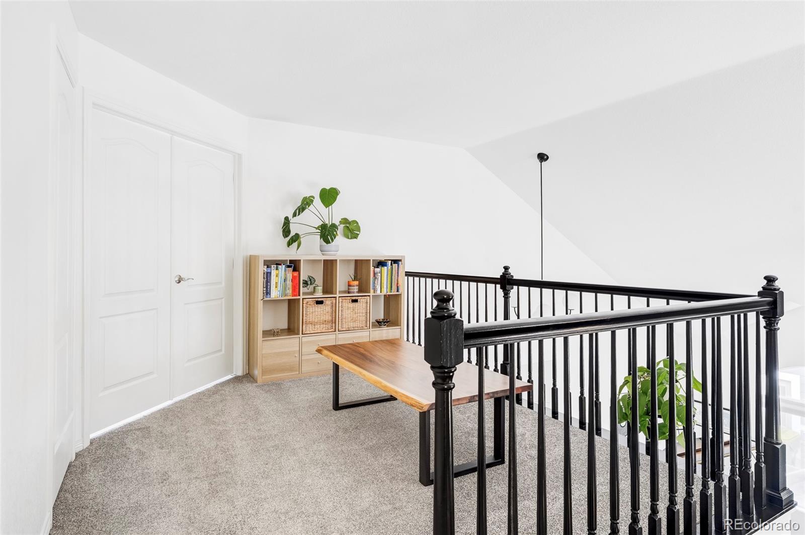 6670 Violet Way Arvada, CO 80007 - Photo 19 of 50 a view of staircase with furniture