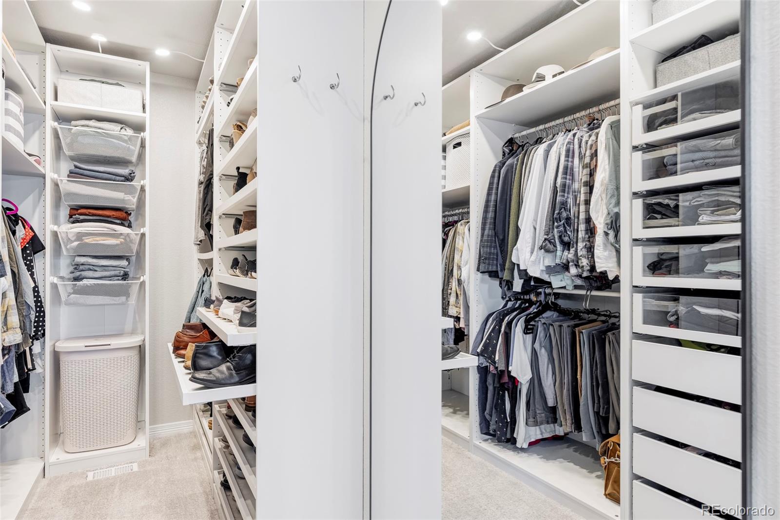 6670 Violet Way Arvada, CO 80007 - Photo 24 of 50 a view of walk in closet with clothes and shoes