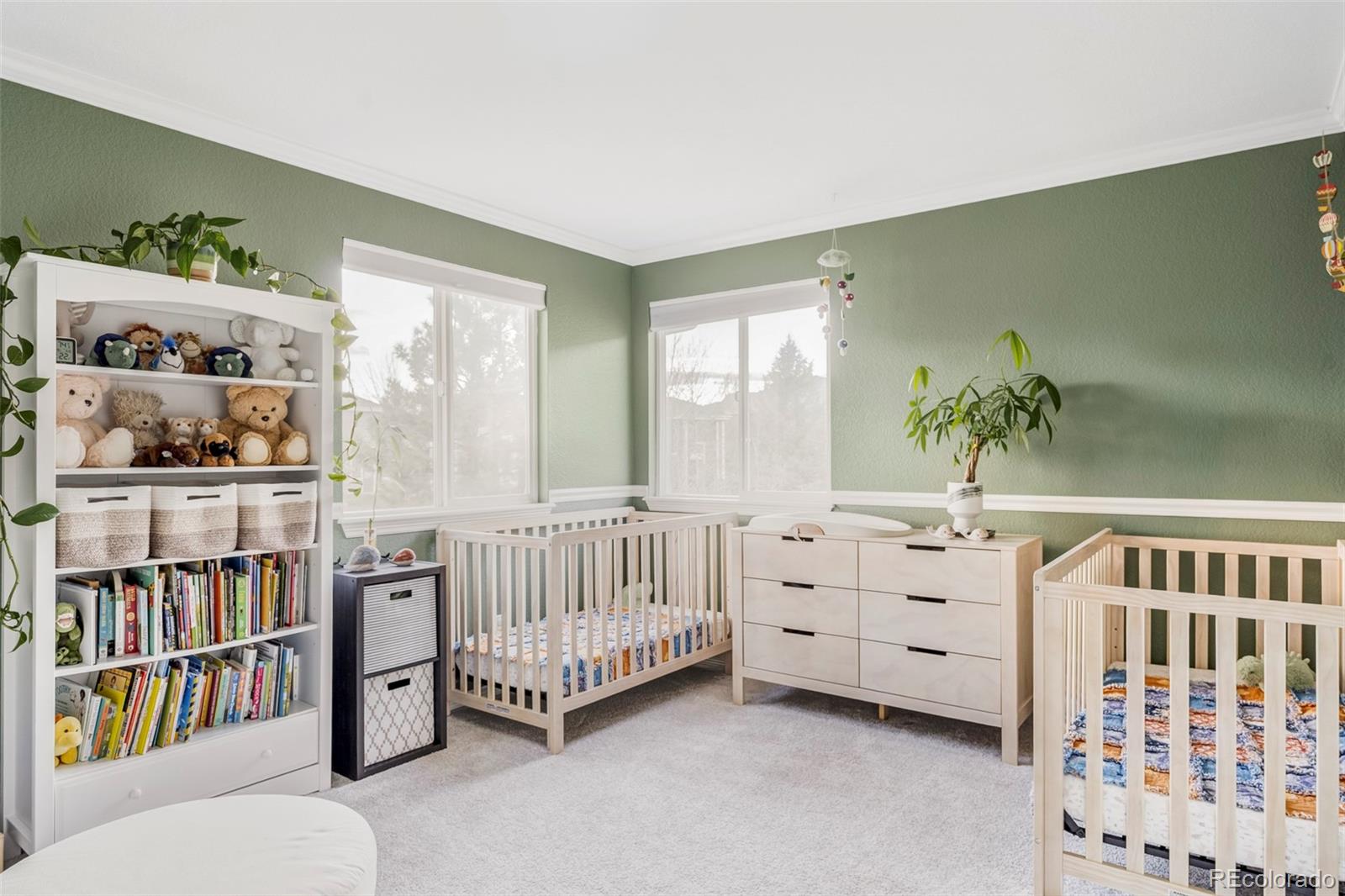 6670 Violet Way Arvada, CO 80007 - Photo 28 of 50 a bedroom with furniture and baby crib