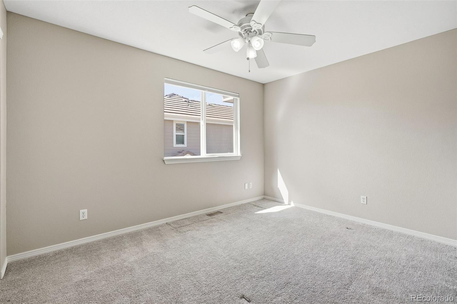 6670 Violet Way Arvada, CO 80007 - Photo 31 of 50 an empty room with a window