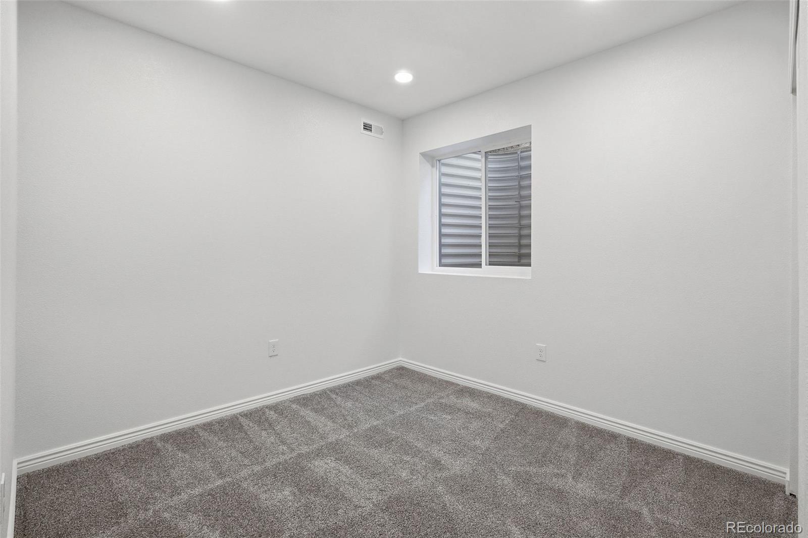 6670 Violet Way Arvada, CO 80007 - Photo 44 of 50 an empty room with a window