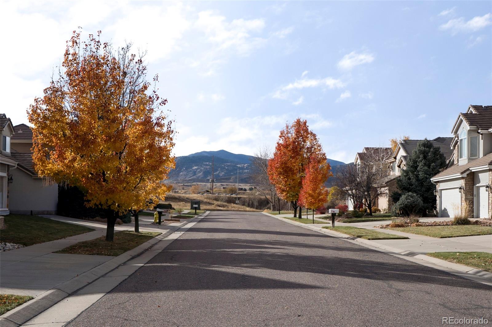6670 Violet Way Arvada, CO 80007 - Photo 47 of 50 a view of city street with a houses