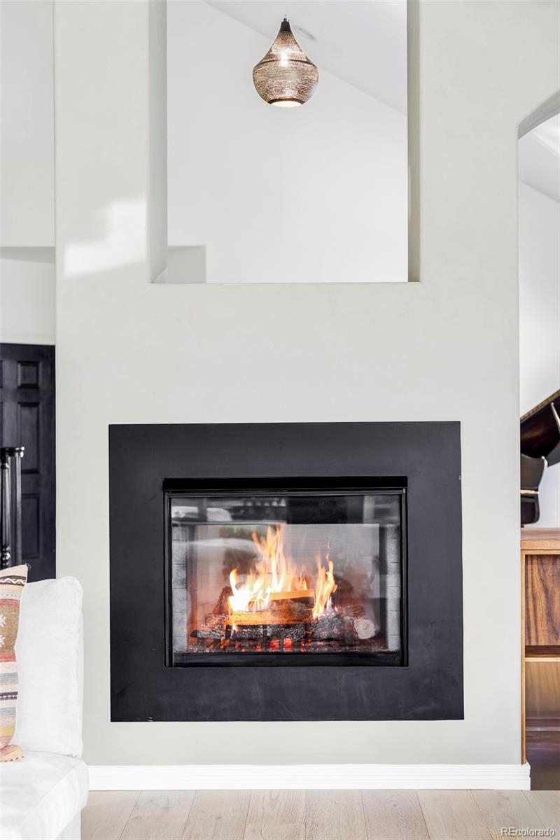 6670 Violet Way Arvada, CO 80007 - Photo 6 of 50 a picture of a living room with a fireplace
