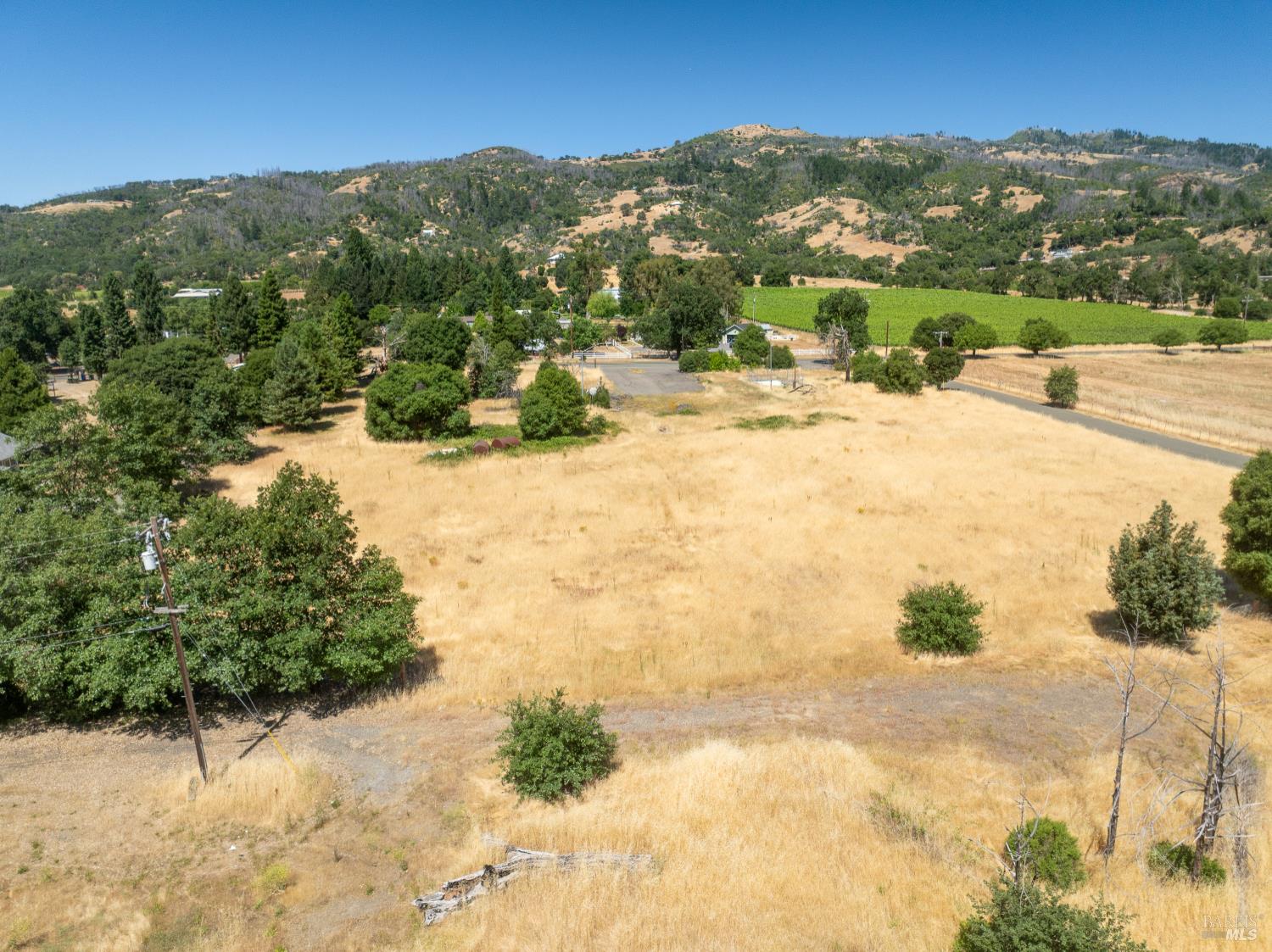 10891 West Road Redwood Valley, CA 95470 - Photo 13 of 28 a view of a lake with mountains in the background