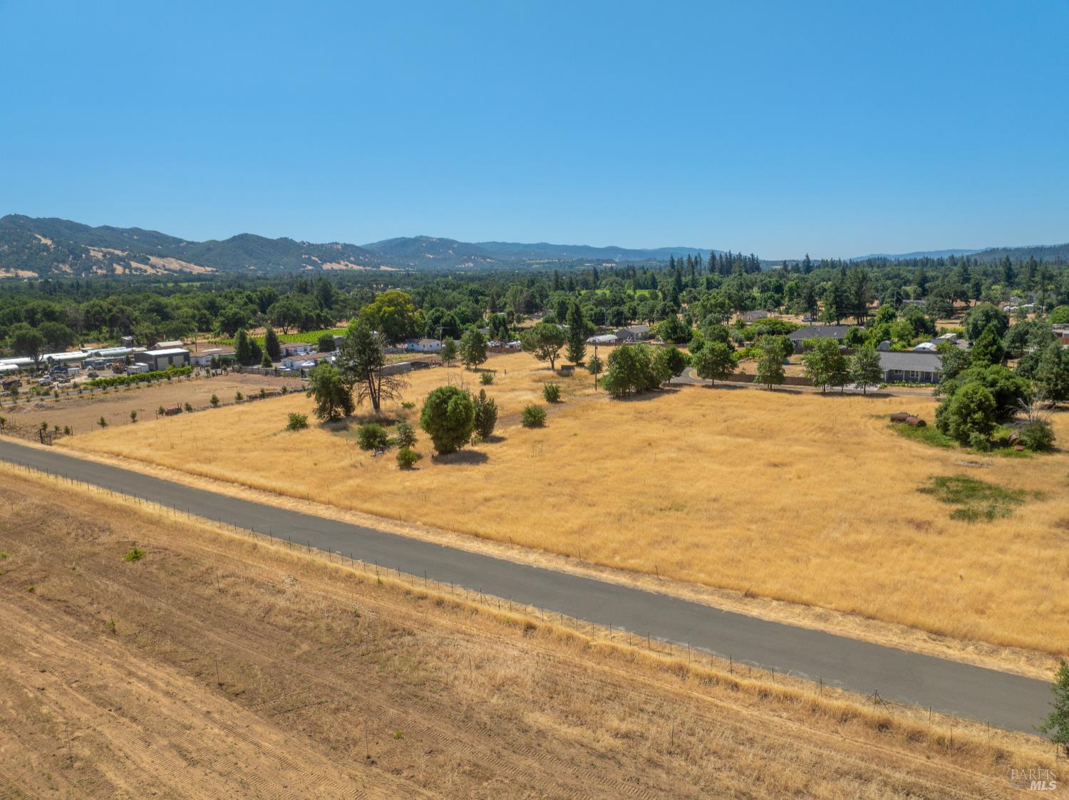 10891 West Road Redwood Valley, CA 95470 - Photo 23 of 28 a view of a lake with a mountain