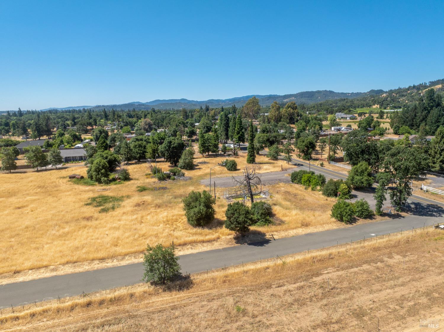 10891 West Road Redwood Valley, CA 95470 - Photo 24 of 28 a view of a lake with a mountain