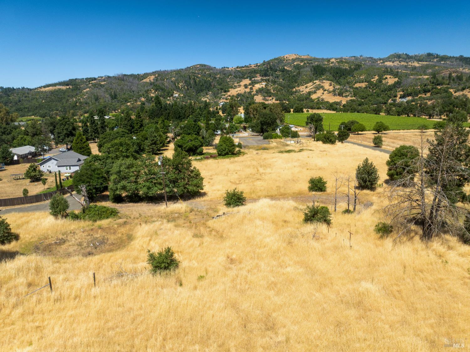 10891 West Road Redwood Valley, CA 95470 - Photo 9 of 28 a view of a lake with mountains in the background