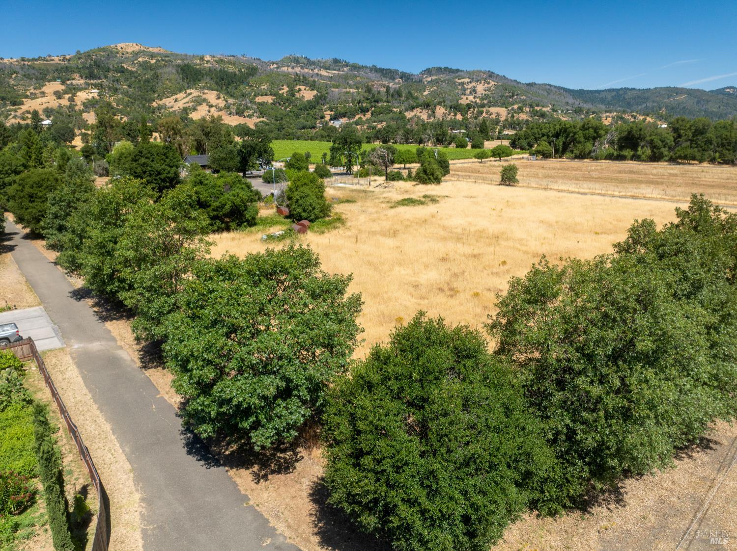 10891 West Road Redwood Valley, CA 95470 - Photo 10 of 28 a view of a lake with mountains in the background
