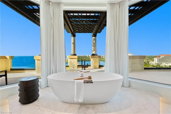 a living room with a couch and a stove top oven