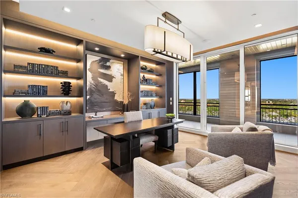 a living room with furniture window and wooden floor