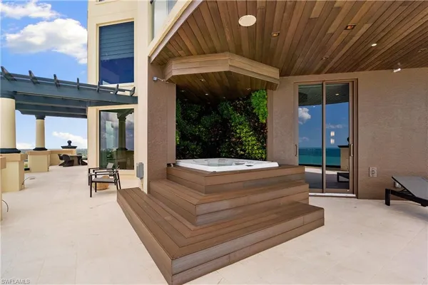 a view of a patio with a table and chairs