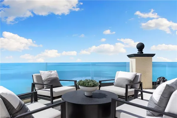 a view of a terrace with furniture and a potted plant