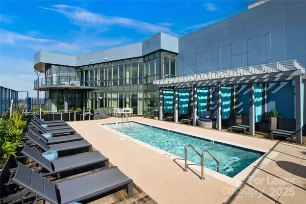 a view of a patio with a table and chairs