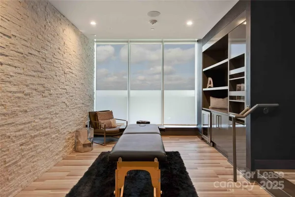 a hallway with a couch and a book shelf