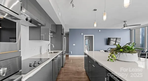 a kitchen with kitchen island granite countertop lots of counter top space