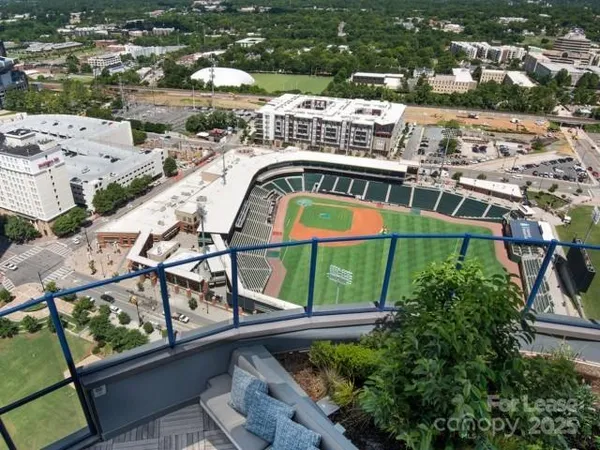 an aerial view of a house with swimming pool lake view and mountain view