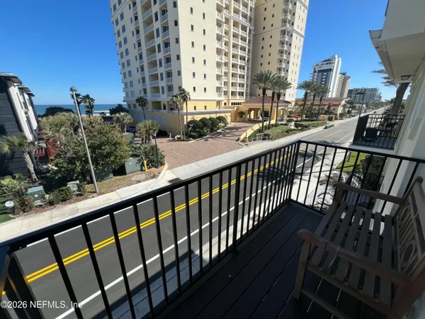 a view of balcony with furniture