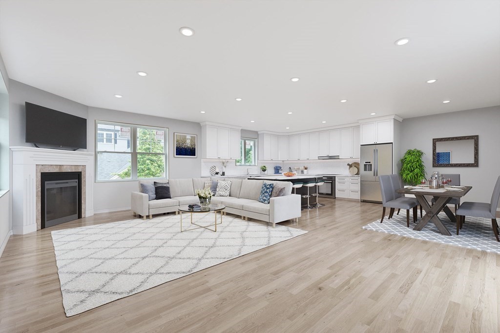 a living room with furniture flat screen tv and a fireplace