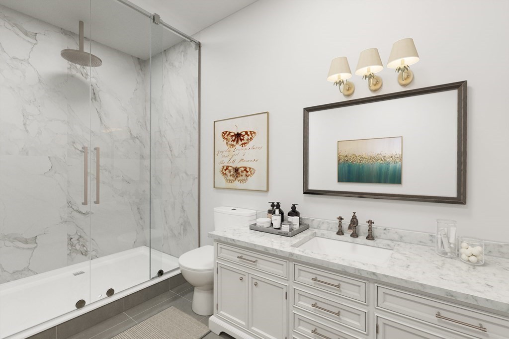 32 Gale Street, Unit 1 Waltham, MA 02453 - Photo 5 of 8 a bathroom with a tub sink toilet and mirror