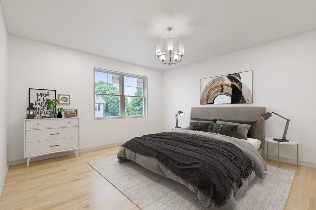 32 Gale Street, Unit 1 Waltham, MA 02453 - Photo 6 of 8 a bedroom with a bed and a window