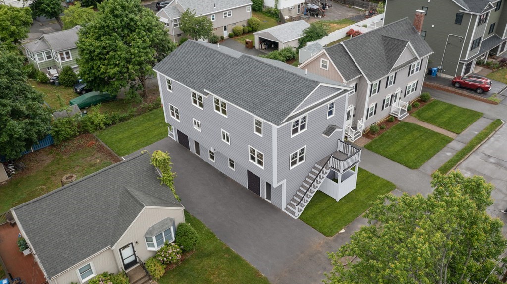 32 Gale Street, Unit 1 Waltham, MA 02453 - Photo 8 of 8 an aerial view of a house with a yard