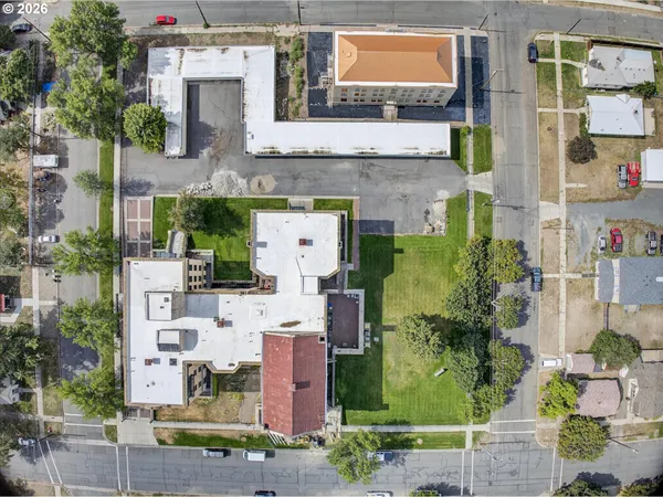 an aerial view of multiple houses with outdoor space