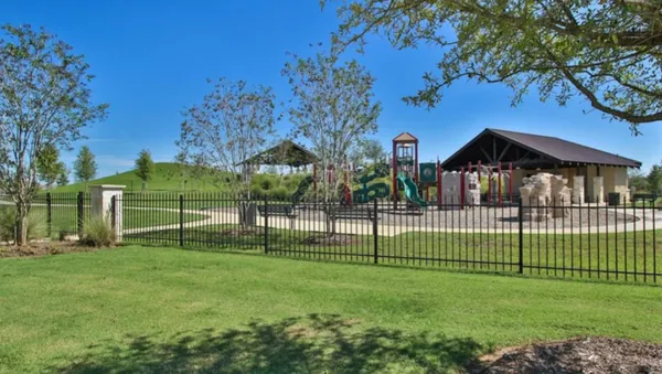 a view of a park with large trees
