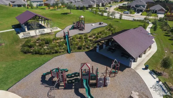 an aerial view of a house having outdoor space patio and outdoor seating
