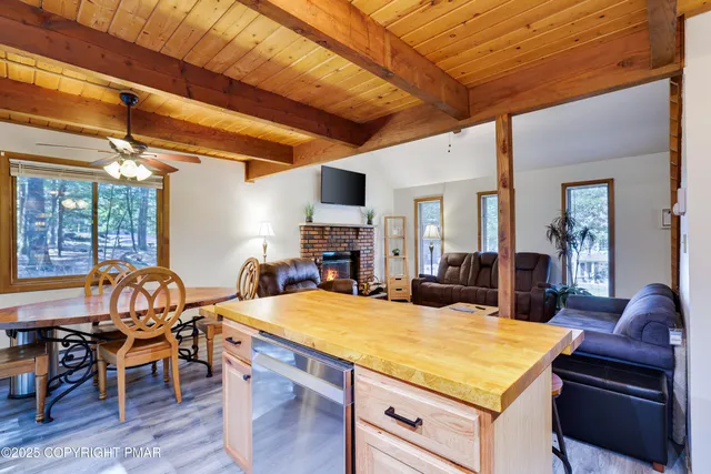 a view of a dining room with furniture and chandelier