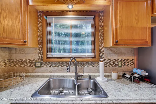 a kitchen with a sink and a window