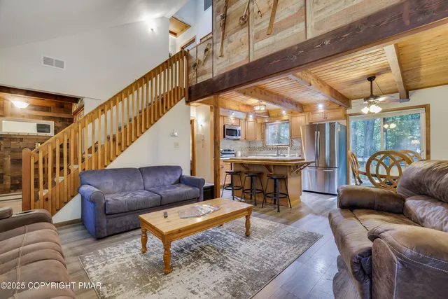 a living room with furniture and a table