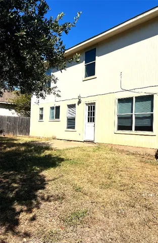 a view of yard with large trees