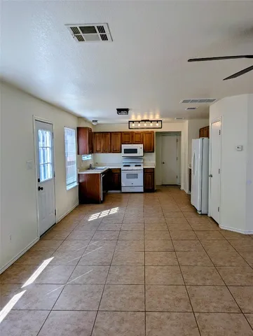 a view of empty room with windows