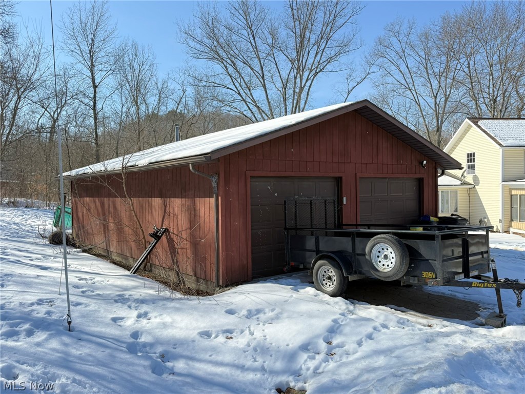 6784 Old Zoarville Road Northeast Dover, OH 44622 - Photo 43 of 50 Snow covered garage featuring a detached garage