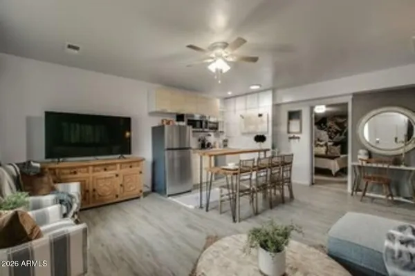 a living room with furniture and a flat screen tv