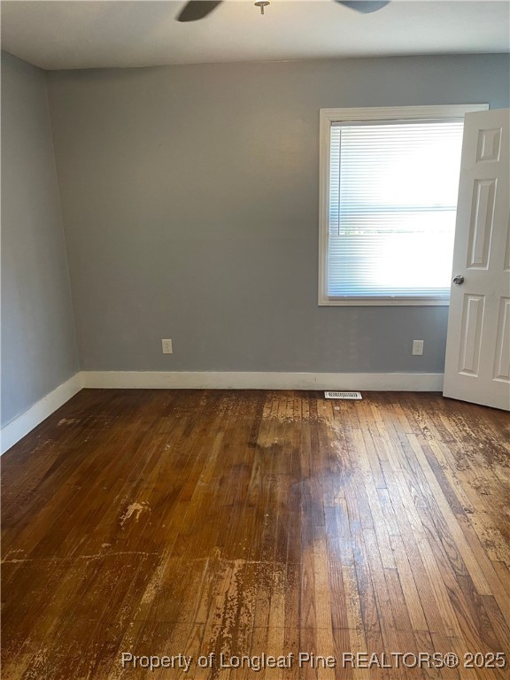 4526 Belford Road Fayetteville, NC 28314 - Photo 16 of 30 a view of empty room with wooden floor and fan
