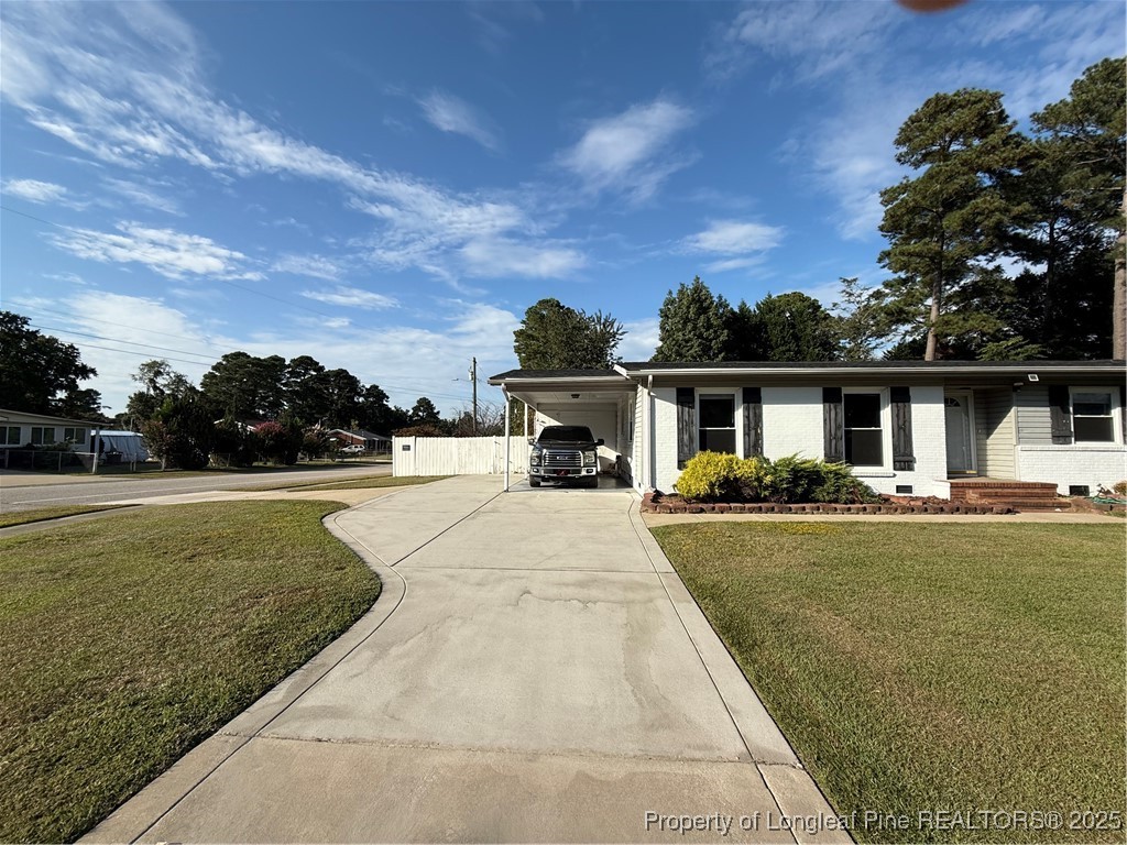 4526 Belford Road Fayetteville, NC 28314 - Photo 2 of 30 front view of a house with a yard