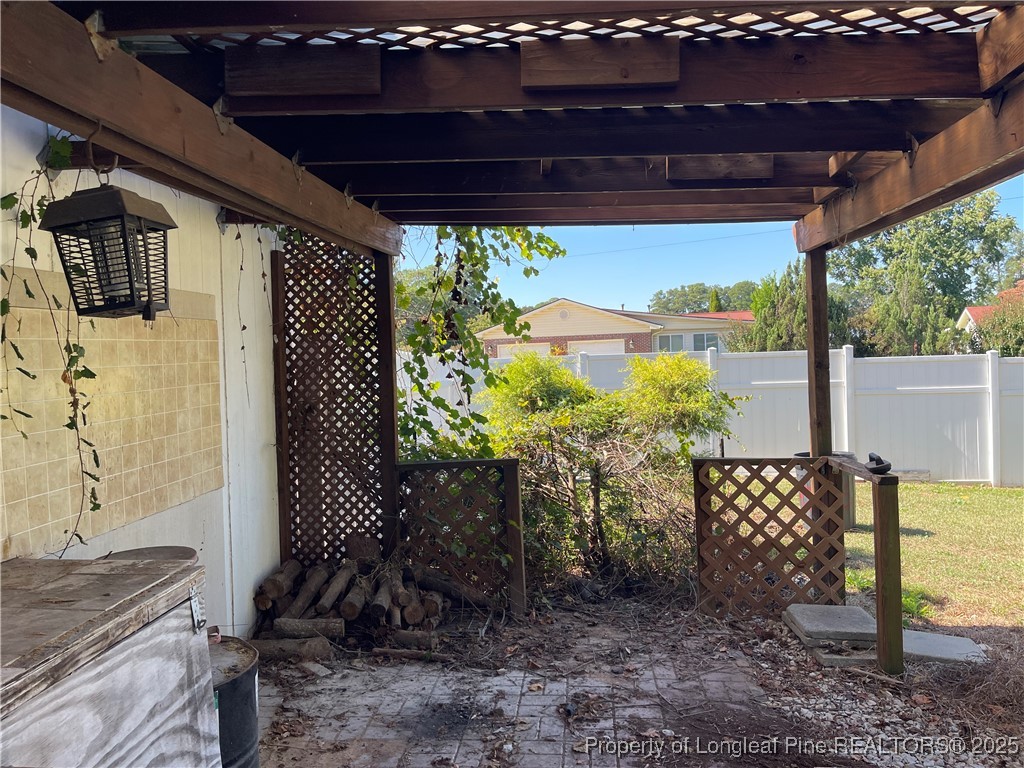 4526 Belford Road Fayetteville, NC 28314 - Photo 23 of 30 a view of a porch with furniture and a yard