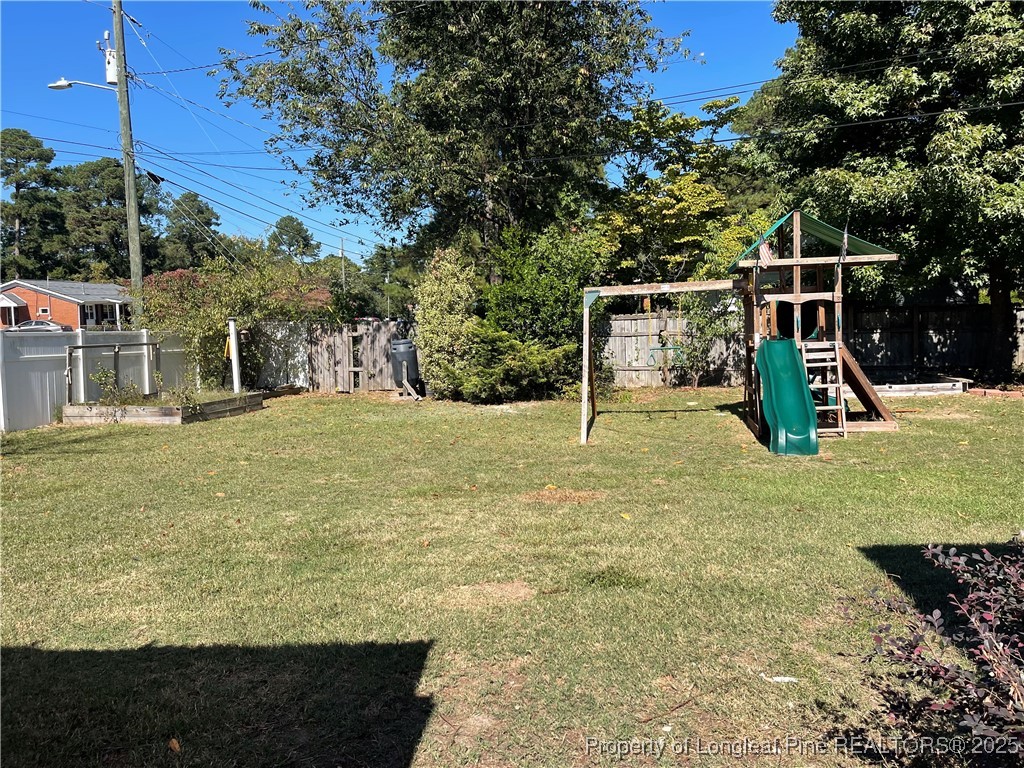 4526 Belford Road Fayetteville, NC 28314 - Photo 24 of 30 a view of a garden with a slide