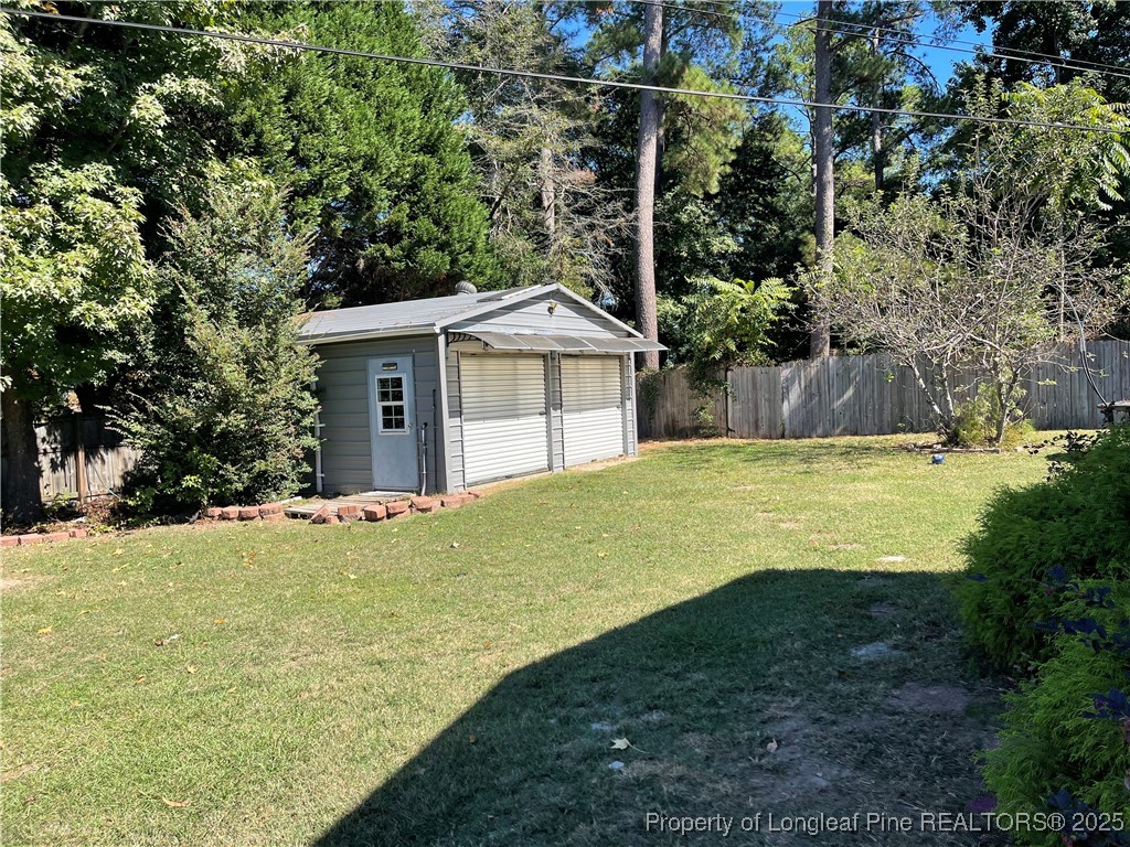 4526 Belford Road Fayetteville, NC 28314 - Photo 25 of 30 a view of a house with a yard and large tree