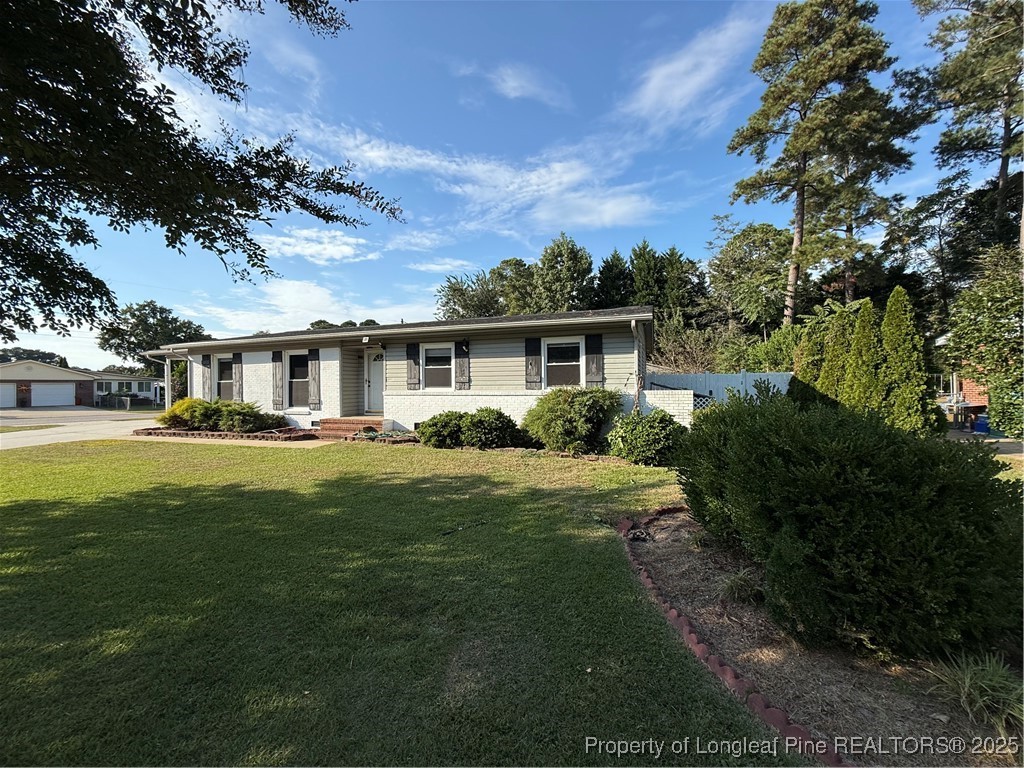 4526 Belford Road Fayetteville, NC 28314 - Photo 3 of 30 a front view of a house with a garden