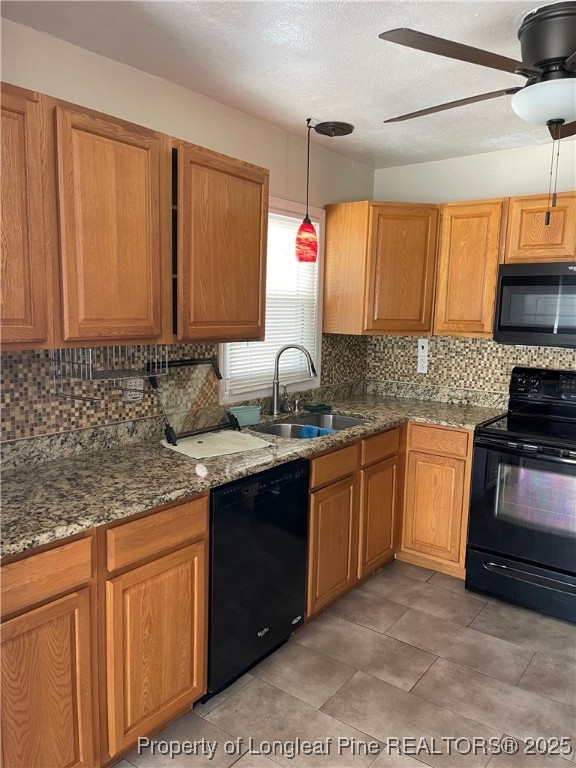 4526 Belford Road Fayetteville, NC 28314 - Photo 6 of 30 a kitchen with stainless steel appliances granite countertop a sink stove and cabinets