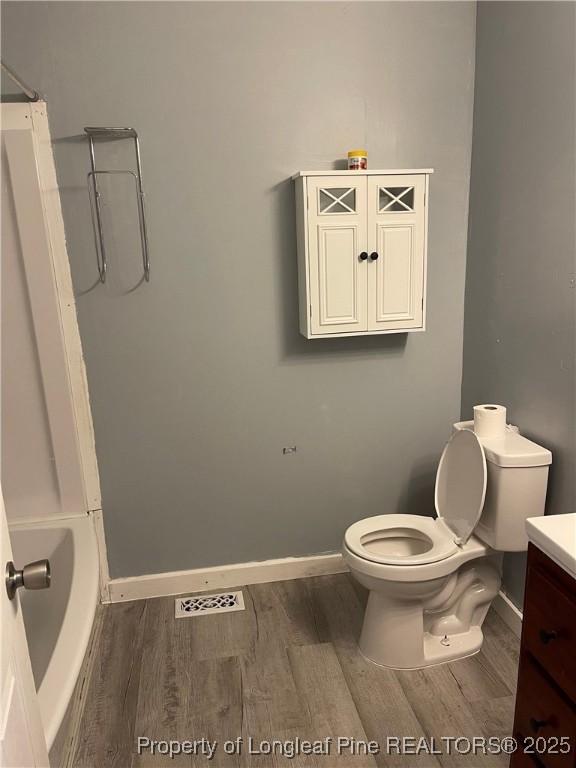 4526 Belford Road Fayetteville, NC 28314 - Photo 10 of 30 a bathroom with a toilet and a mirror