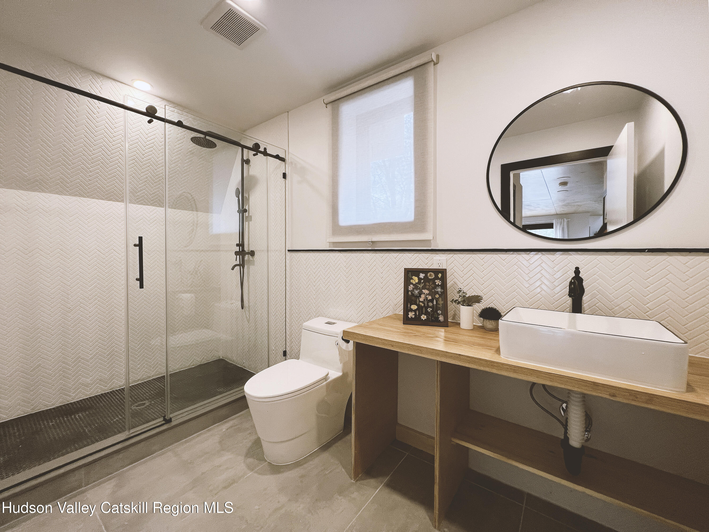 238 Grist Mill Road Tillson, NY 12486 - Photo 12 of 21 a bathroom with a sink and a mirror