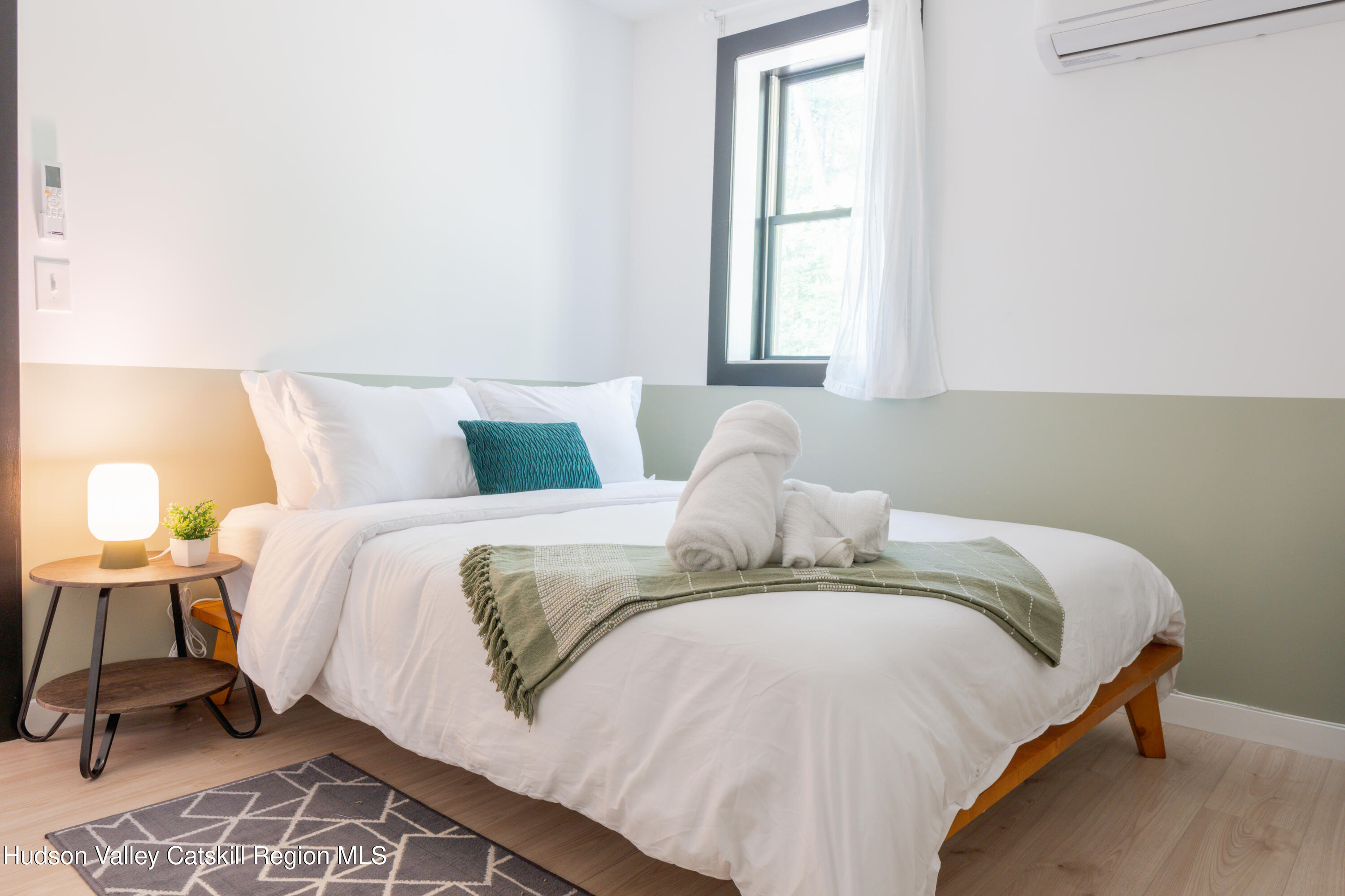 238 Grist Mill Road Tillson, NY 12486 - Photo 15 of 21 a bedroom with a bed and a window