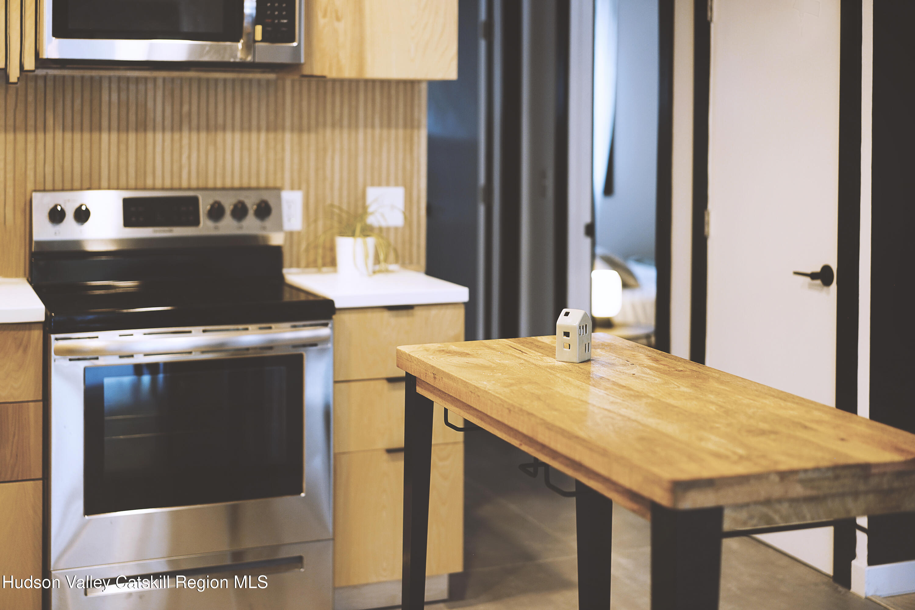 238 Grist Mill Road Tillson, NY 12486 - Photo 8 of 21 a view of a kitchen with granite countertop a stove and a sink