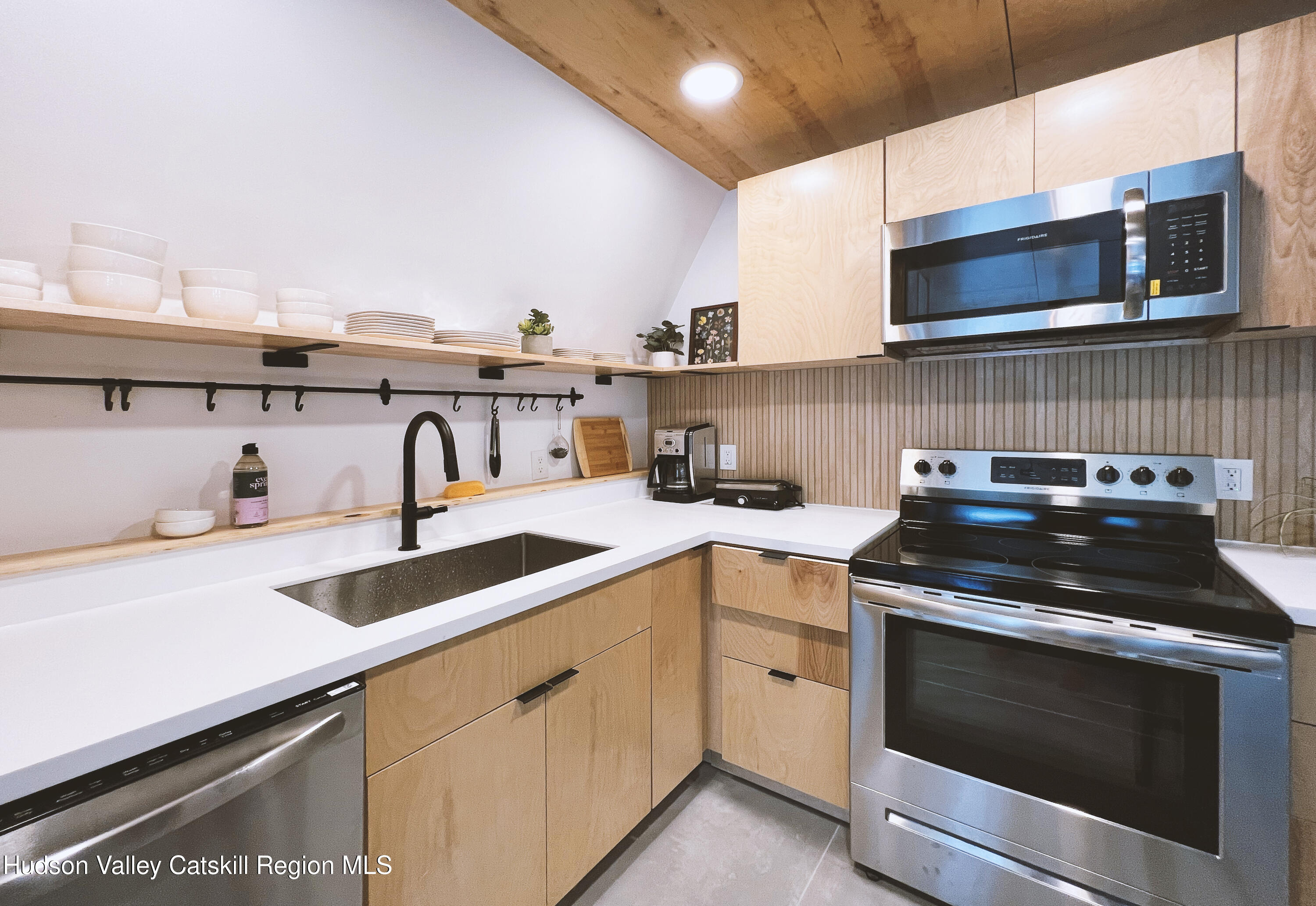 238 Grist Mill Road Tillson, NY 12486 - Photo 9 of 21 a kitchen with a sink stove and microwave