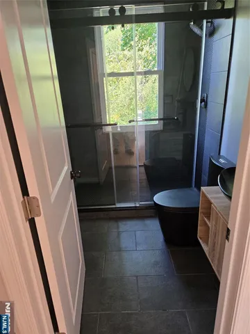 a bathroom with a sink and toilet