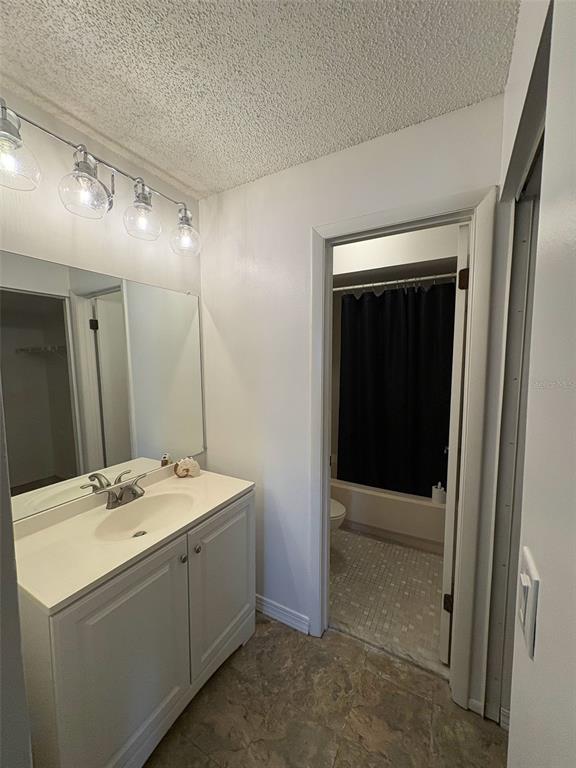 3260 Candle Ridge Drive, Unit 202 Orlando, FL 32822 - Photo 11 of 19 a room with a sink and a mirror