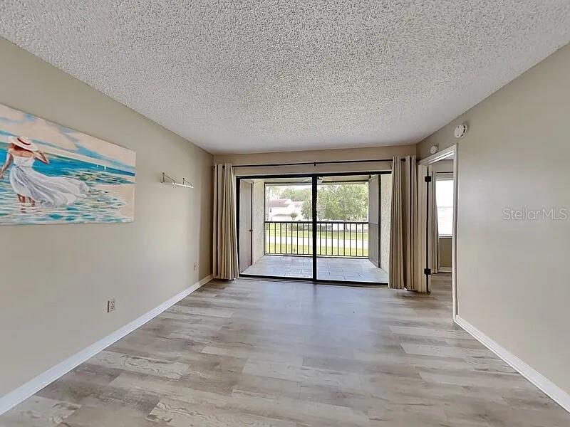 3260 Candle Ridge Drive, Unit 202 Orlando, FL 32822 - Photo 7 of 19 a view of an empty room with a window